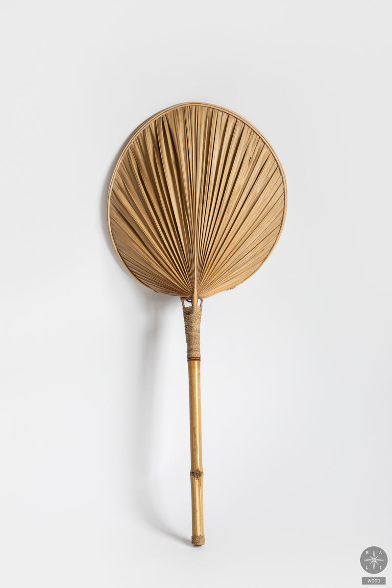 Wall lamp made of palm leaves