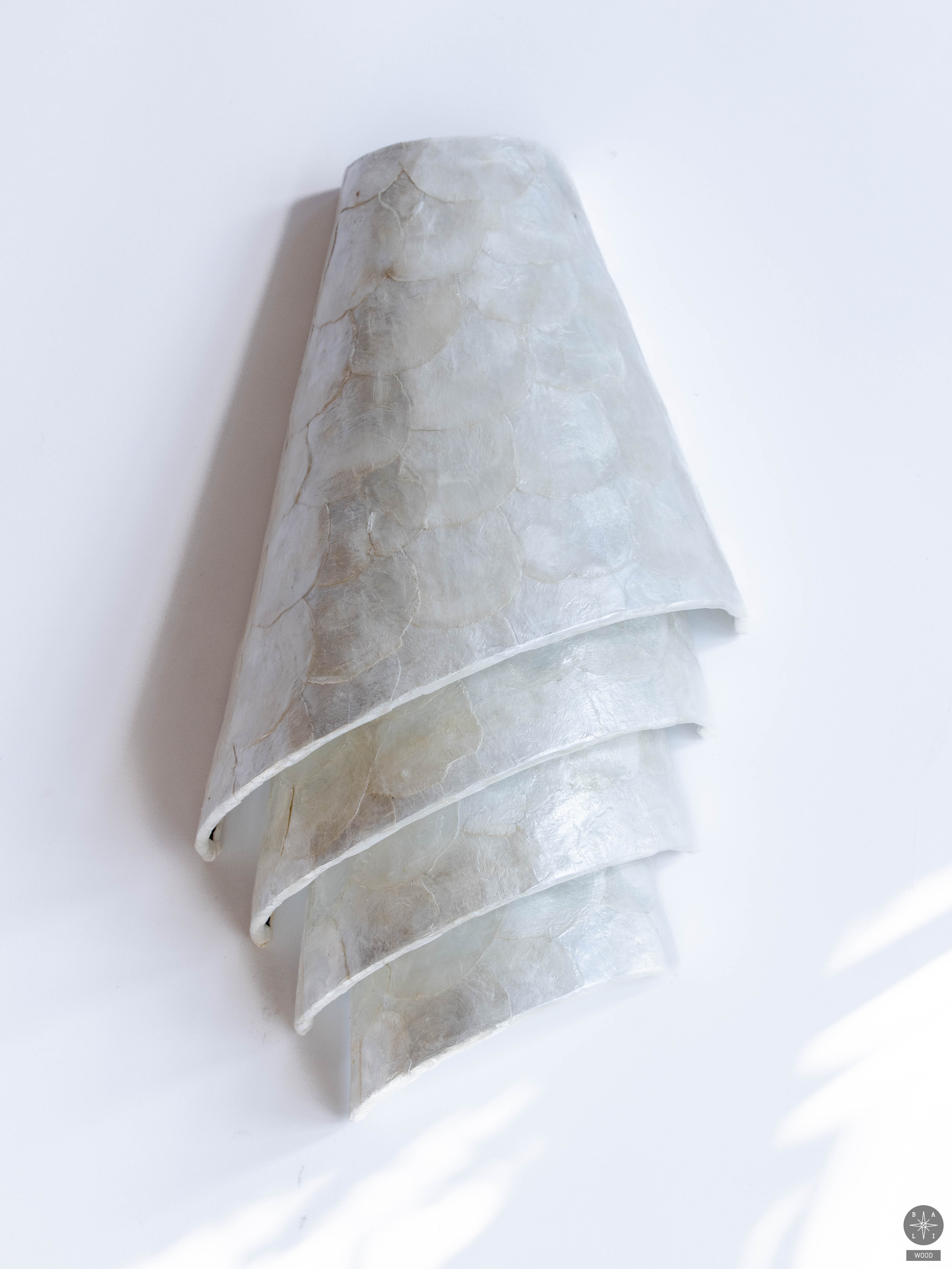 Wall lamp shade made of seashells