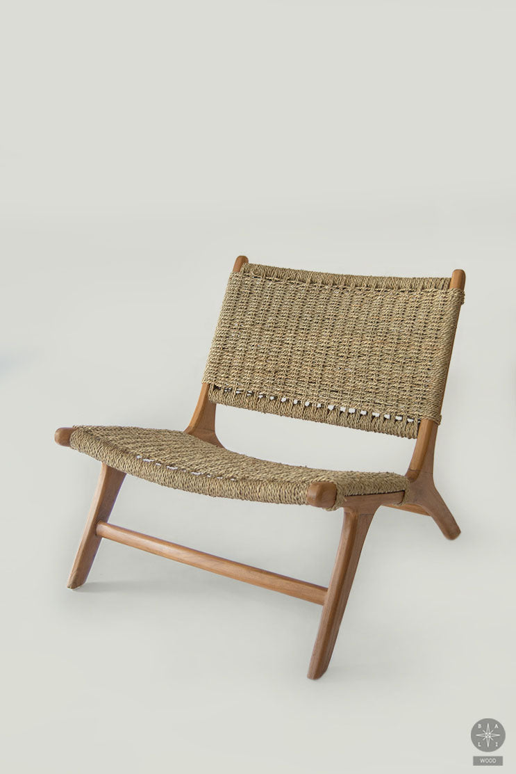 Low chair made of teak wood and seagrass