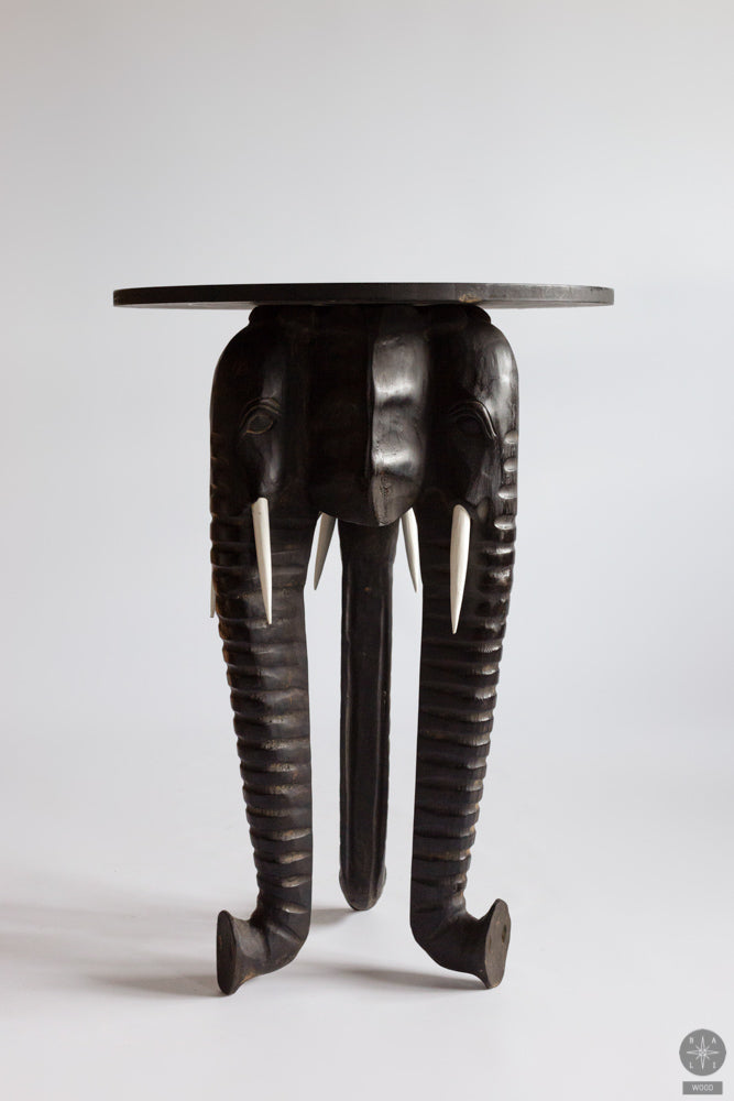 Wooden table with elephant decor