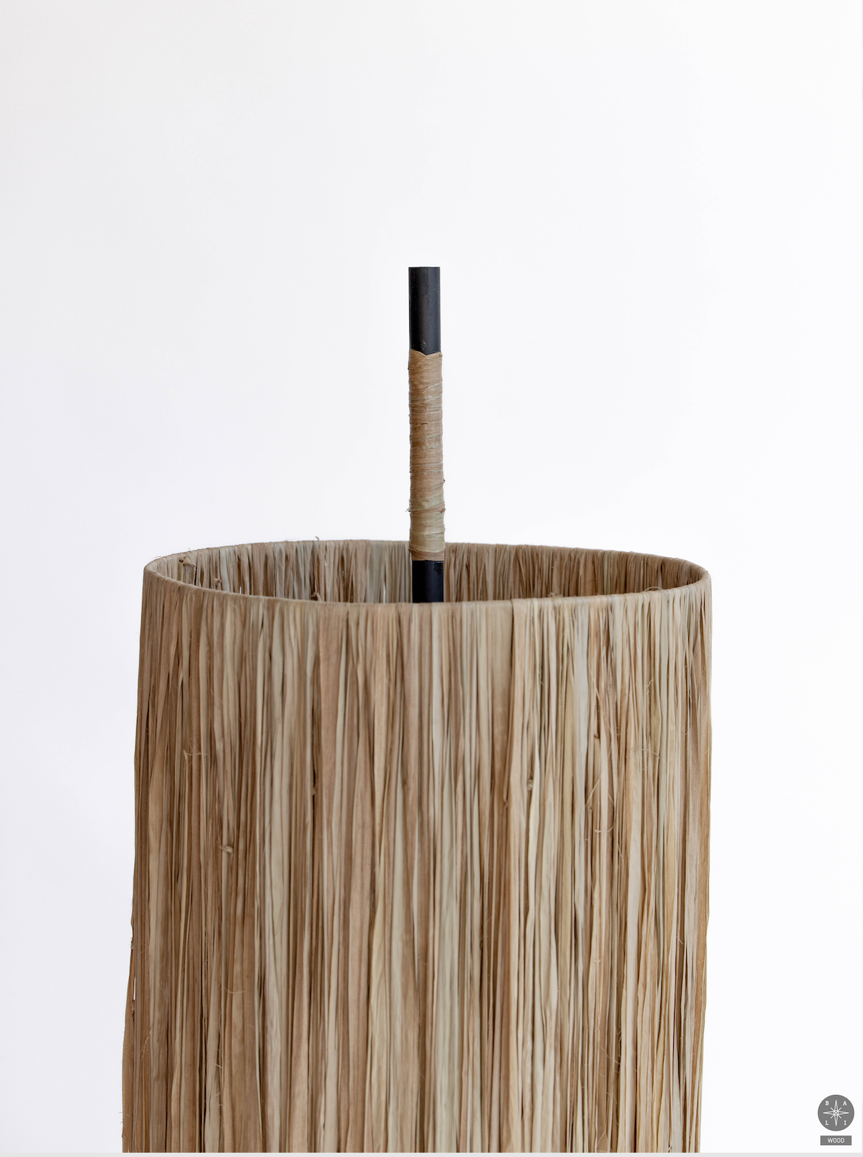 Floor lamp with a raffia lampshade