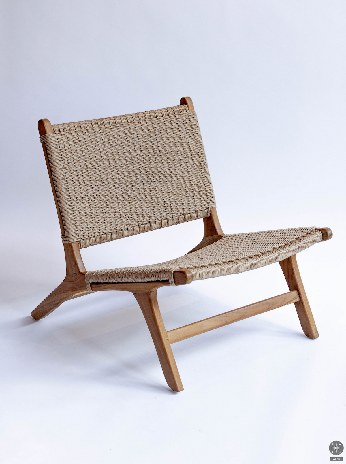 Low chair made of teak wood and synthetic rattan