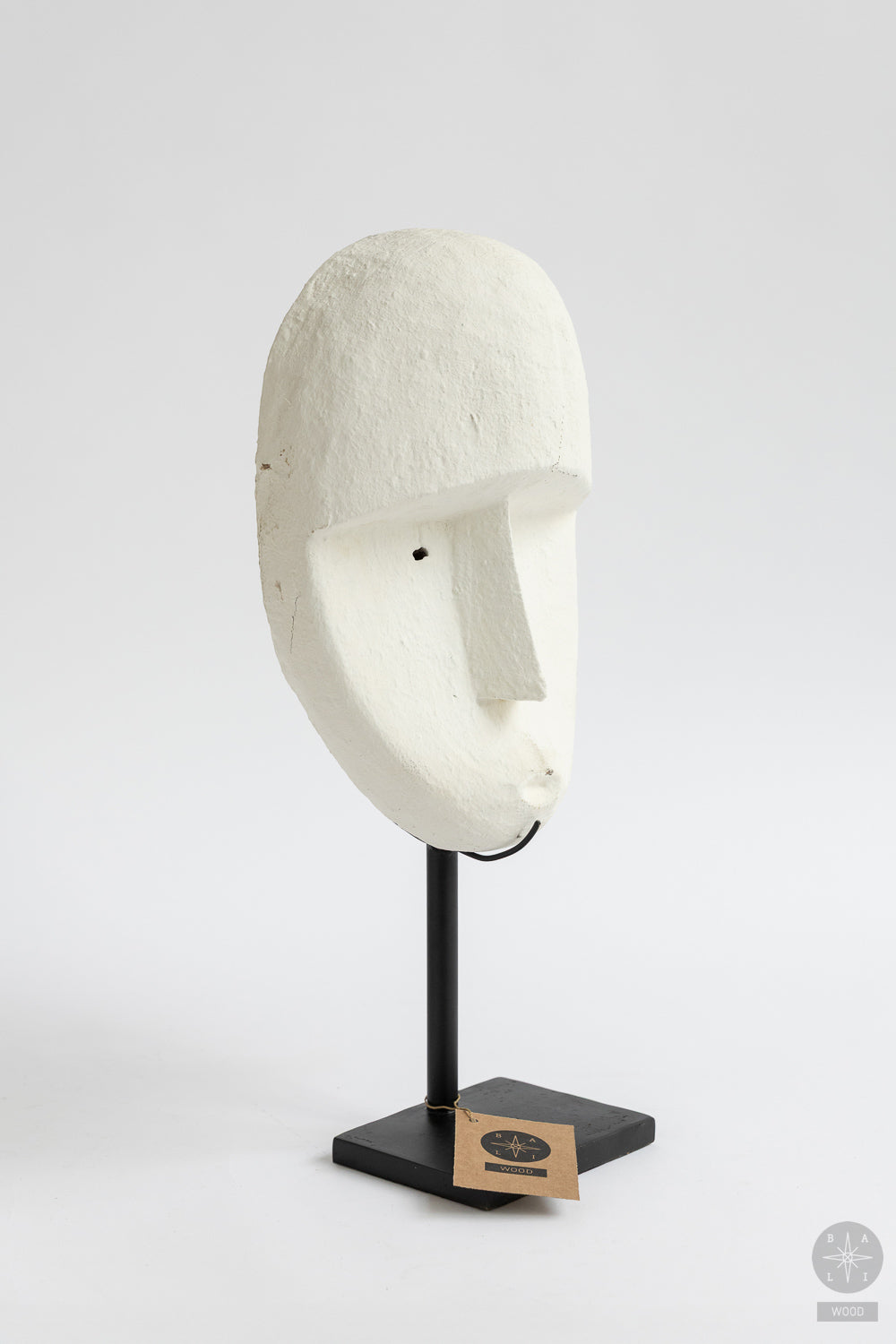 Teak mask on a metal stand