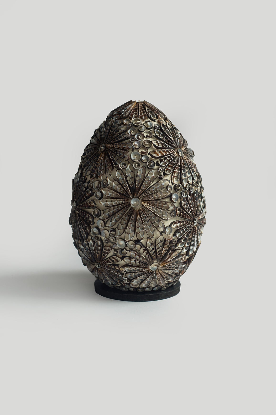 Table lamp made of dark shells