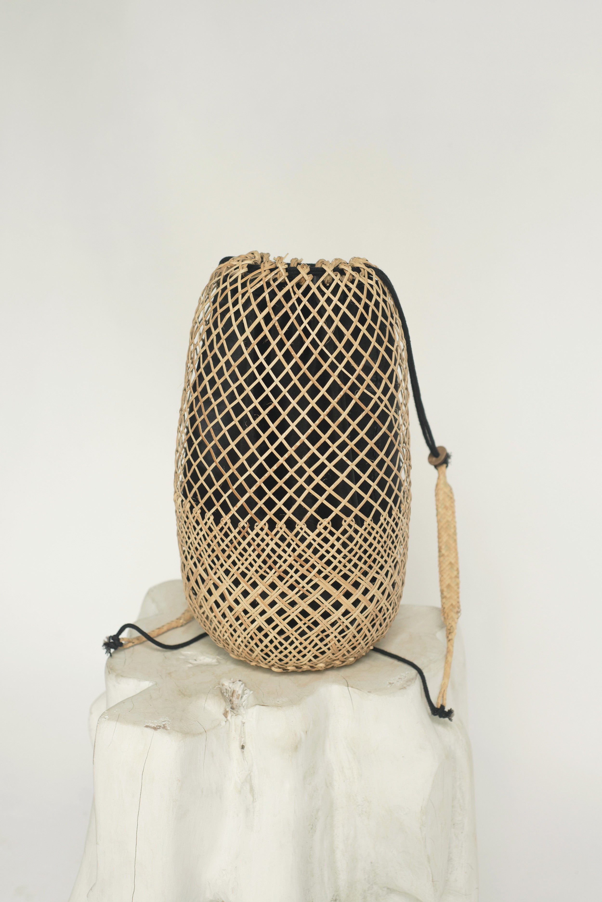 Woven backpack with black fabric