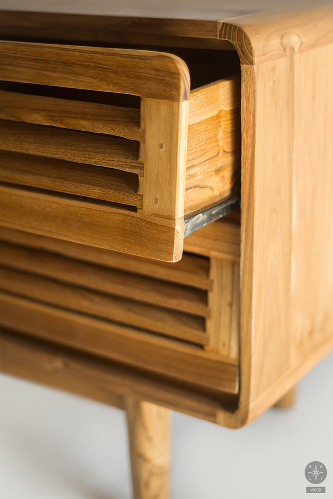 Low teak wood cabinet of drawers