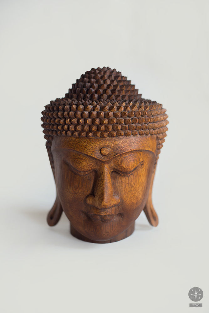 Buddha head made of teak wood