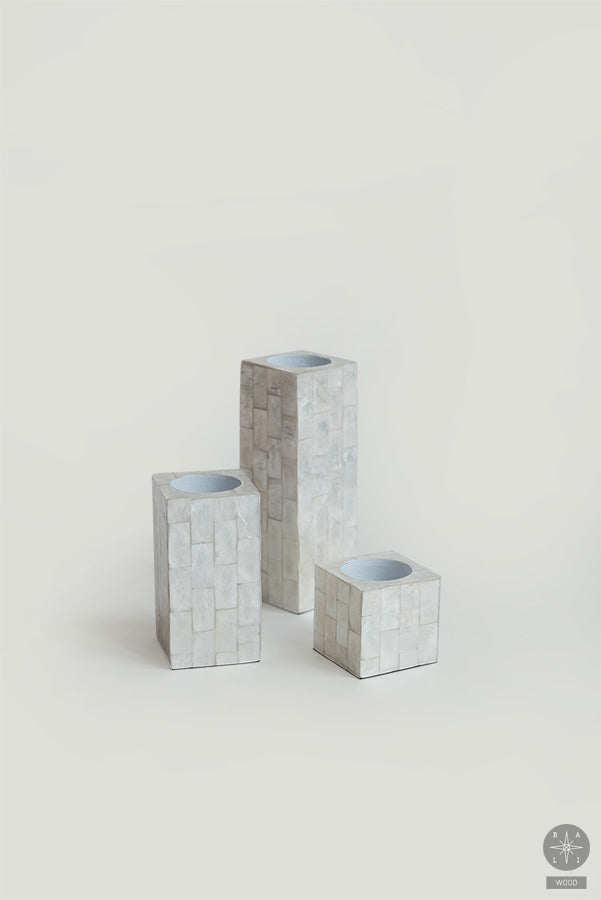 Candle holder decorated with shells